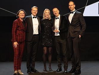 Winners of the Research Live 2024 award for business impact of the year - global, collect the award on stage at the 2024 MRS Awards